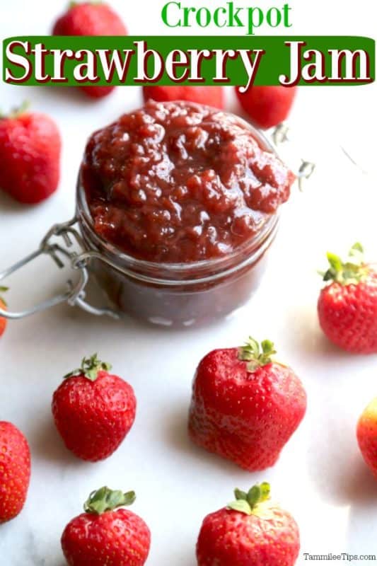 Crockpot Strawberry Jam over a glass container with jam and strawberries