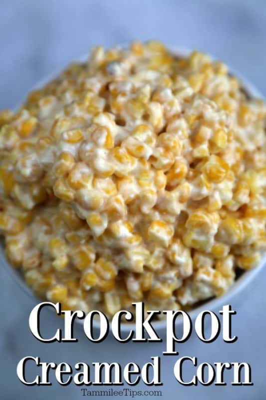 Crockpot Creamed Corn in a white bowl on a white background. 