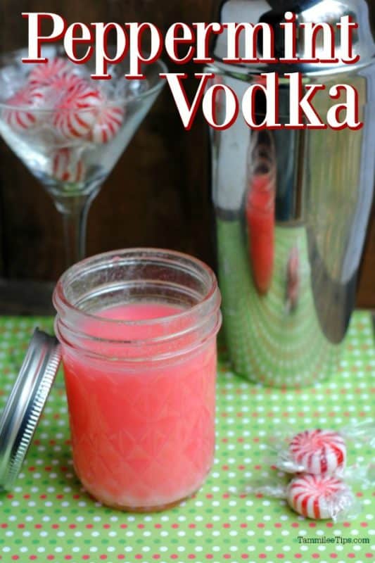 Peppermint Vodka over a mason jar with red liquid and peppermint candies