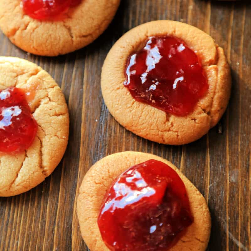 Peanut Butter and Jelly Cookies on a wood cutting board