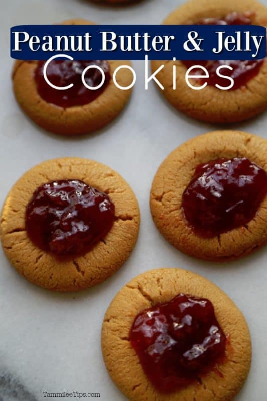 Peanut Butter and Jelly Cookies text over parchment lined baking sheet with cookies