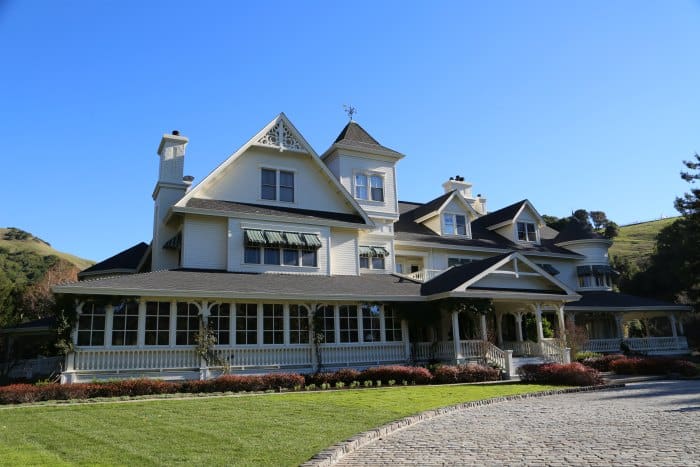 Decorative white house with a large white porch