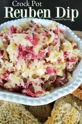 Crockpot Reuben Dip over a white bowl with corned beef sauerkraut dip