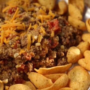 spicy taco beef with cheese next to Frito Chips