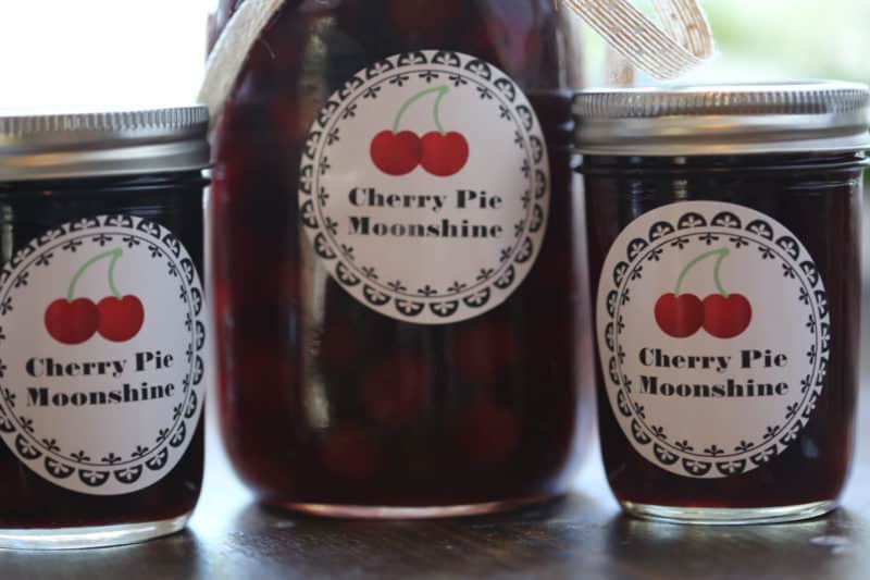 Cherry Pie Moonshine jars lined up next to each other 