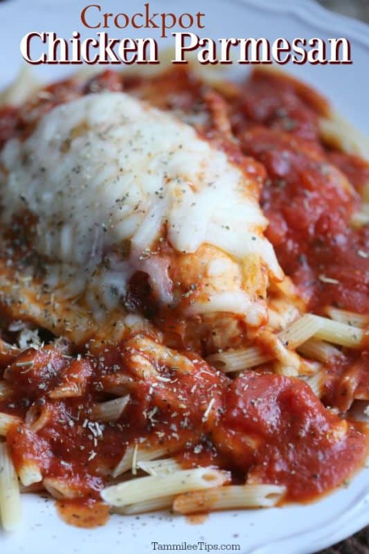 crockpot chicken parmesan over a chicken breast with melted mozzarella, on top of penne pasta with sauce