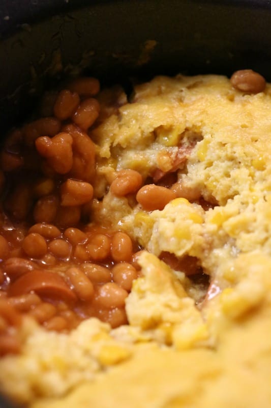 Corn dog casserole with beans in a slow cooker bowl 