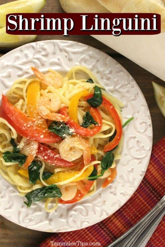 Shrimp linguini over a plate with shrimp, noodles, and peppers