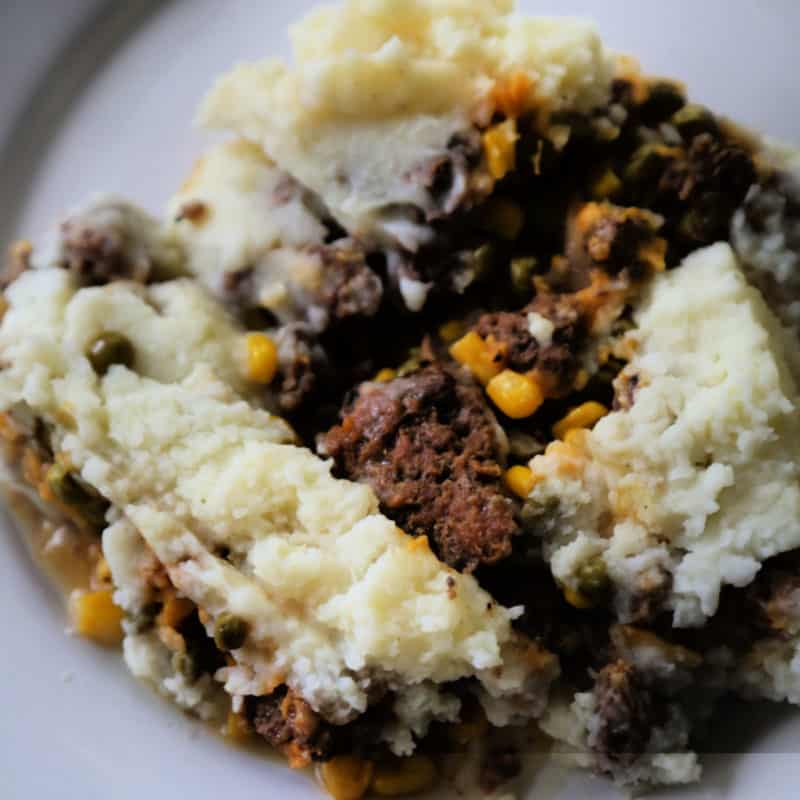 Crock Pot Shepherd's Pie with potatoes, ground beef, and corn on a white plate