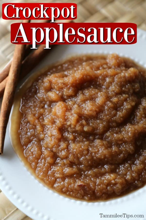 Crockpot Applesauce text over a white bowl with applesauce and cinnamon sticks