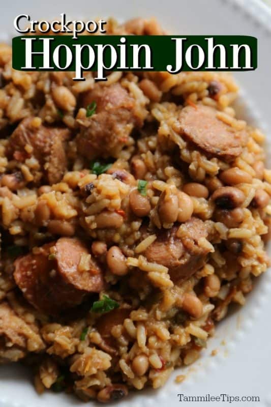 Crockpot Hoppin John over a white plate piled high with rice, kielbasa, and more. 