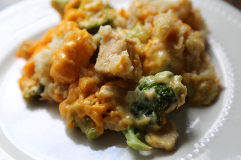 chicken tater tot casserole with broccoli on a white plate
