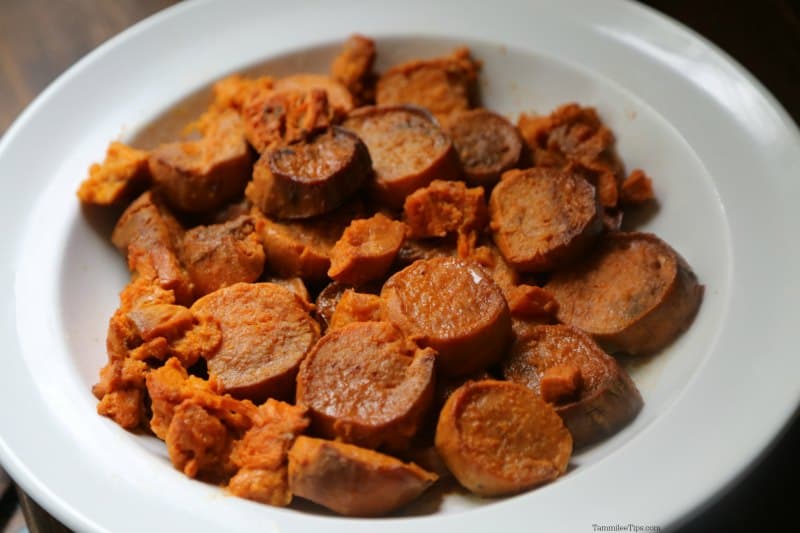 Slow Cooker Candied Sweet Potatoes on a white serving dish