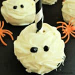 mummy cake pop with orange plastic spiders near it