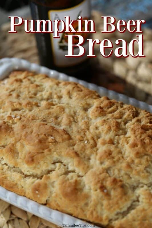 pumpkin beer bread over a loaf of bread in a white baking dish