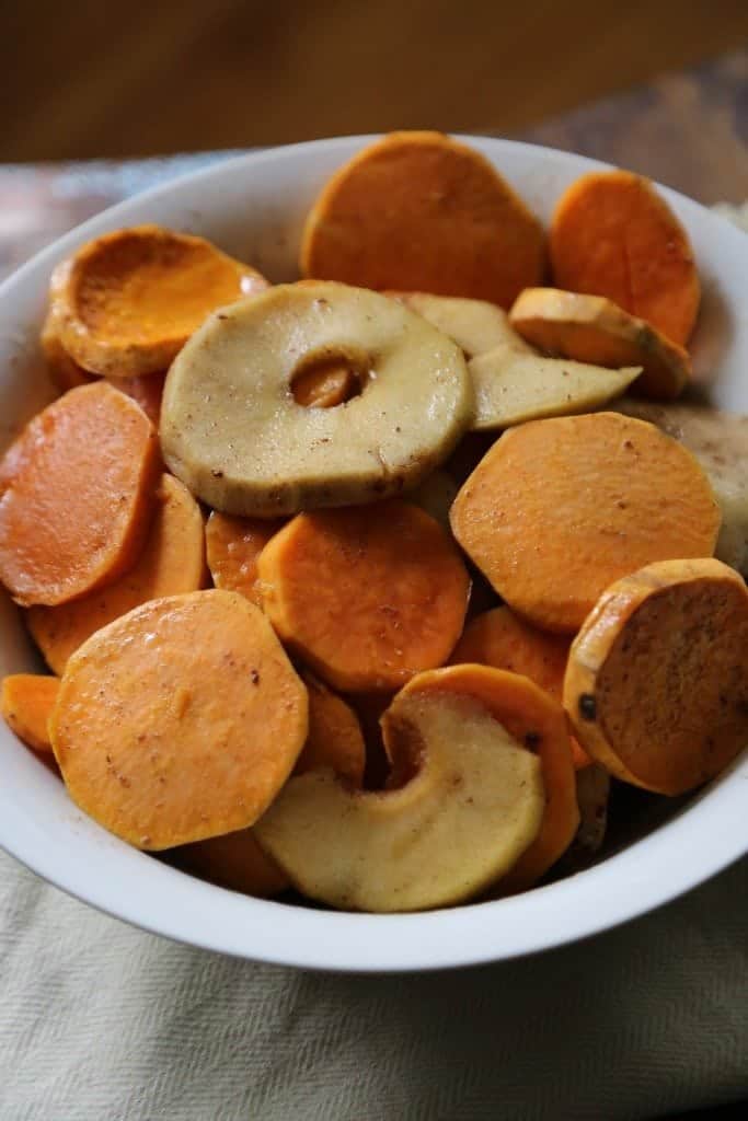 Crock Pot Apples and sweet potatoes slices in a white bowl