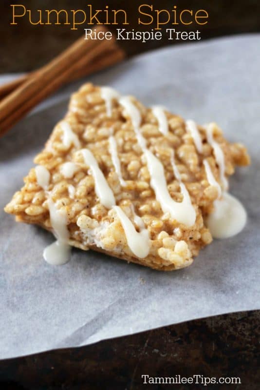 Pumpkin spice rice krispie treat text written above a rice krispie treat on parchment paper with cinnamon sticks in the backgroun. 