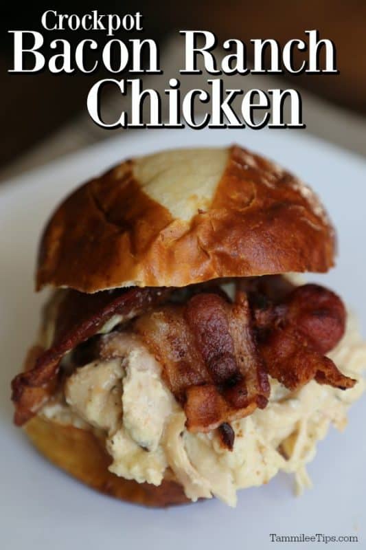 Crockpot Bacon Ranch Chicken over a white plate with a bacon ranch chicken sandwich on a bun