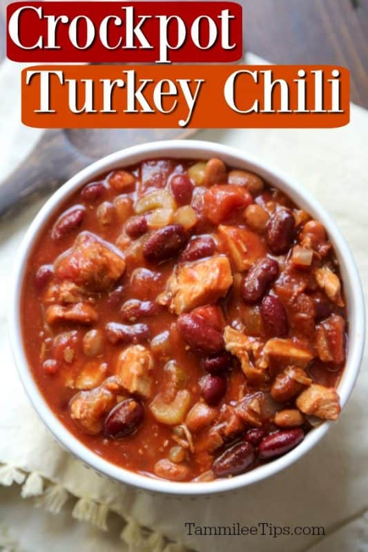 Crockpot Turkey Chili in a white bowl with a wood spoon next to it. 