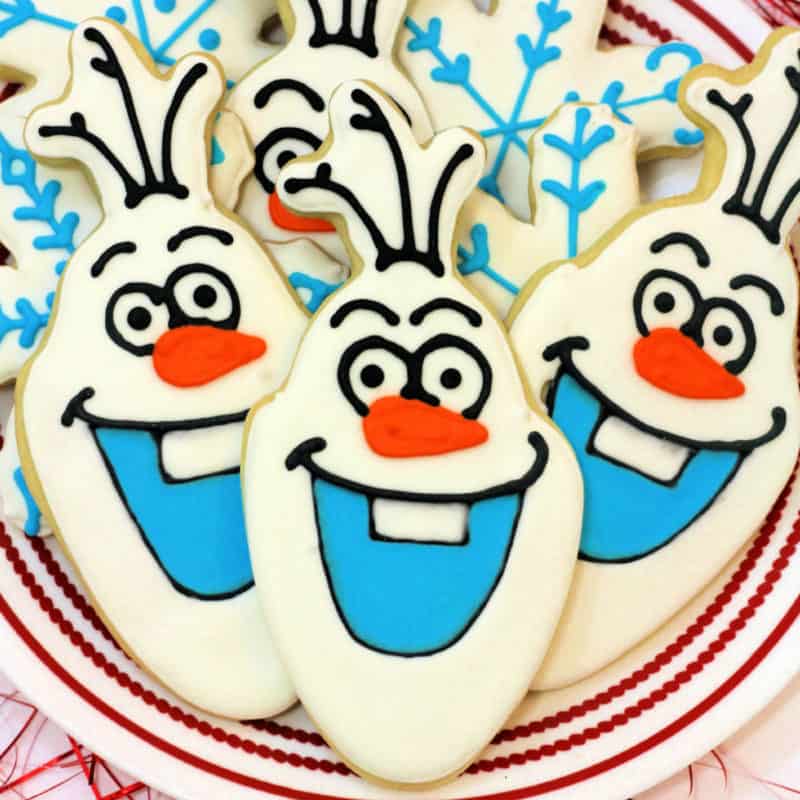 Olaf Cookies piled on a white plate