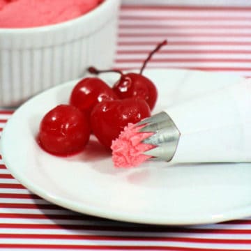 Cherry Frosting on a white plate with maraschino cherries