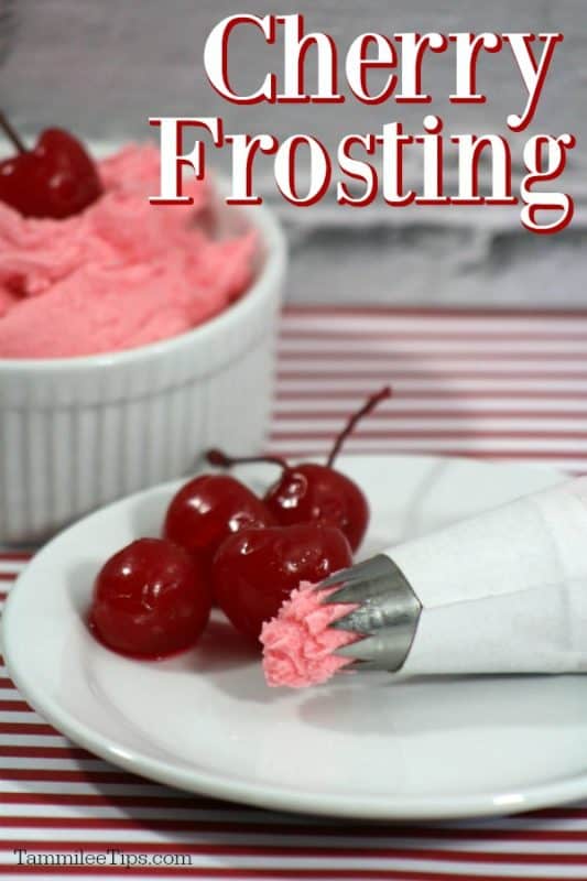 Cherry frosting over a white plate a icing dispenser and maraschino cherries, next to a bowl of icing 