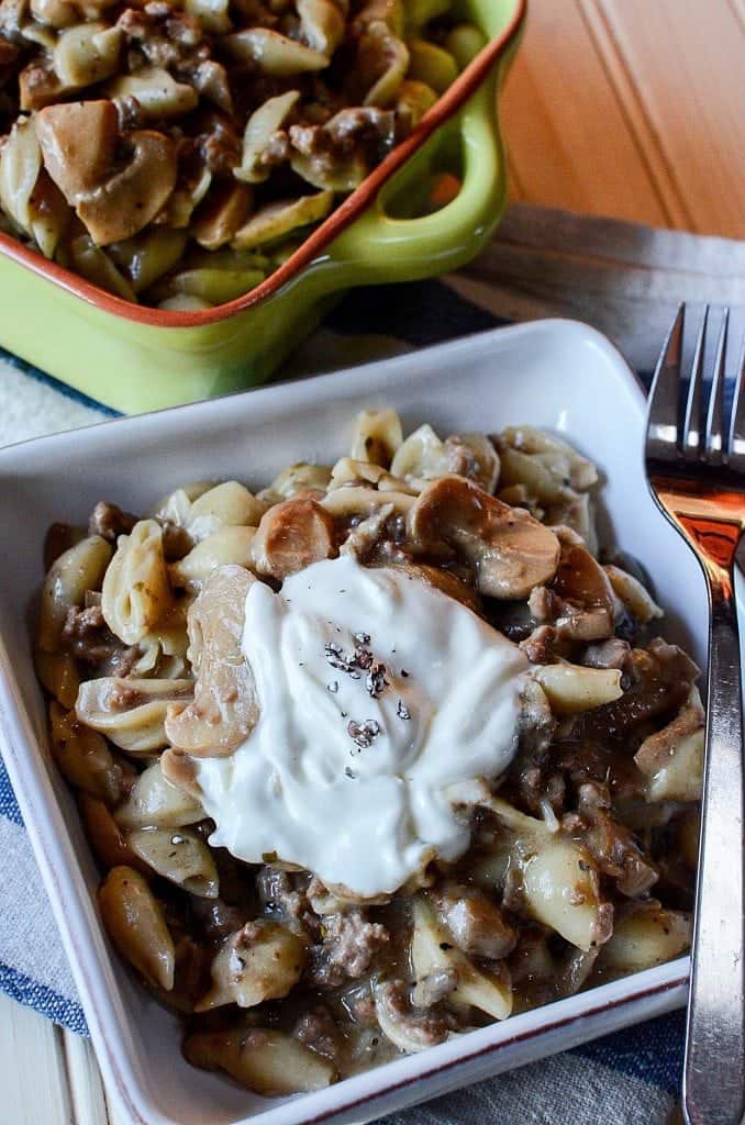 Crock Pot Mushroom, Ground Beef, Pasta Casserole Recipe with sour cream! This slow cooker crockpot casserole recipe is the perfect family dinners comfort food meal! Filled with beef and pasta your family will love it! 