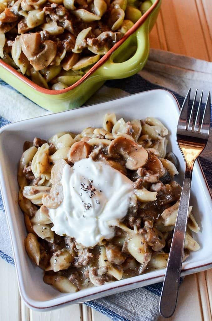 Crock Pot Mushroom, Ground Beef, Pasta Casserole Recipe with sour cream! This slow cooker crockpot casserole recipe is the perfect family dinners comfort food meal! Filled with beef and pasta your family will love it! 