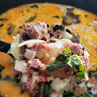 Crockpot Zuppa Toscana Soup text over a slow cooker filled with soup