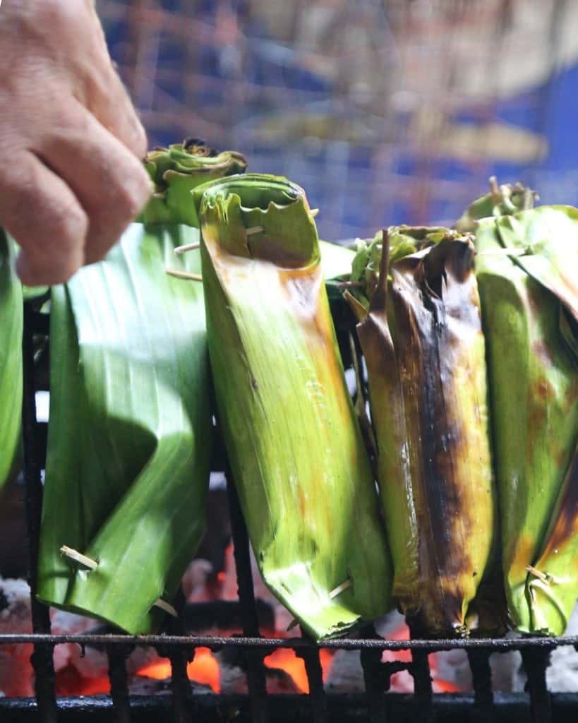 cooking over coals at Sunday Market Thailand