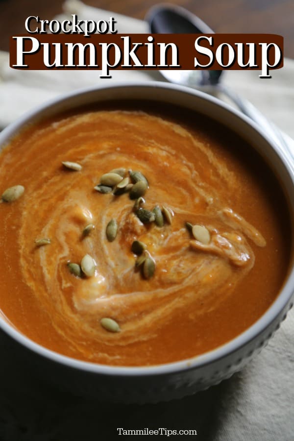 Crockpot Pumpkin Soup text over a white bowl filled with pumpkin soup garnished with pepita