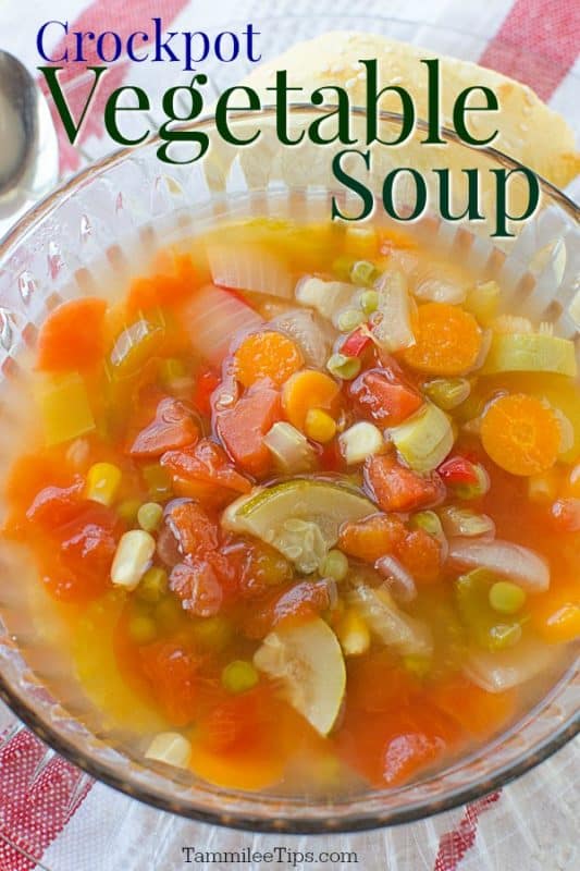 crockpot vegetable soup over a clear bowl filled with soup