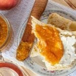Crock Pot Peach Butter Recipe perfect for canning or enjoying fresh! This slow cooker recipe is so easy and you can easily make it a spiced peach if you want! Use your canning jars to make this into a great gift idea! This fresh peach recipe is beyond delicious and easy to make!