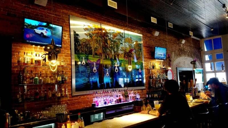 restaurant interior with blue dog painting 