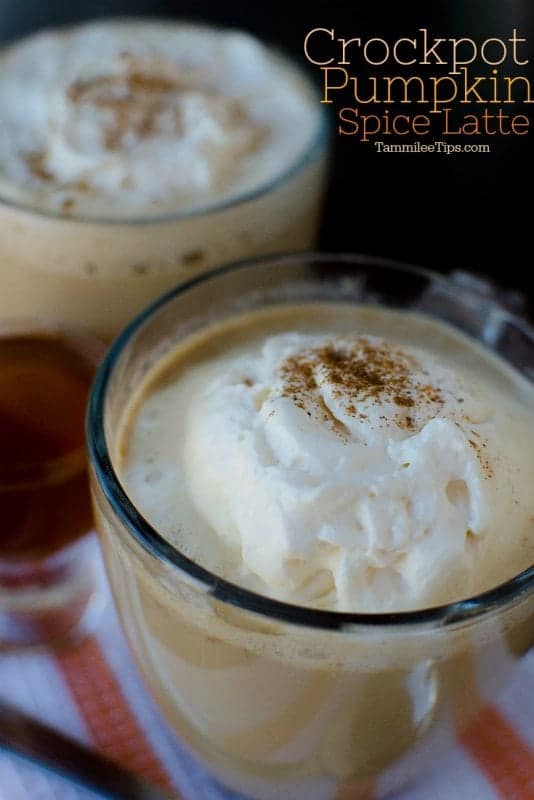 Crockpot Pumpkin Spice Latte text above 2 pumpkin spice lattes in glass mugs on a towel. 