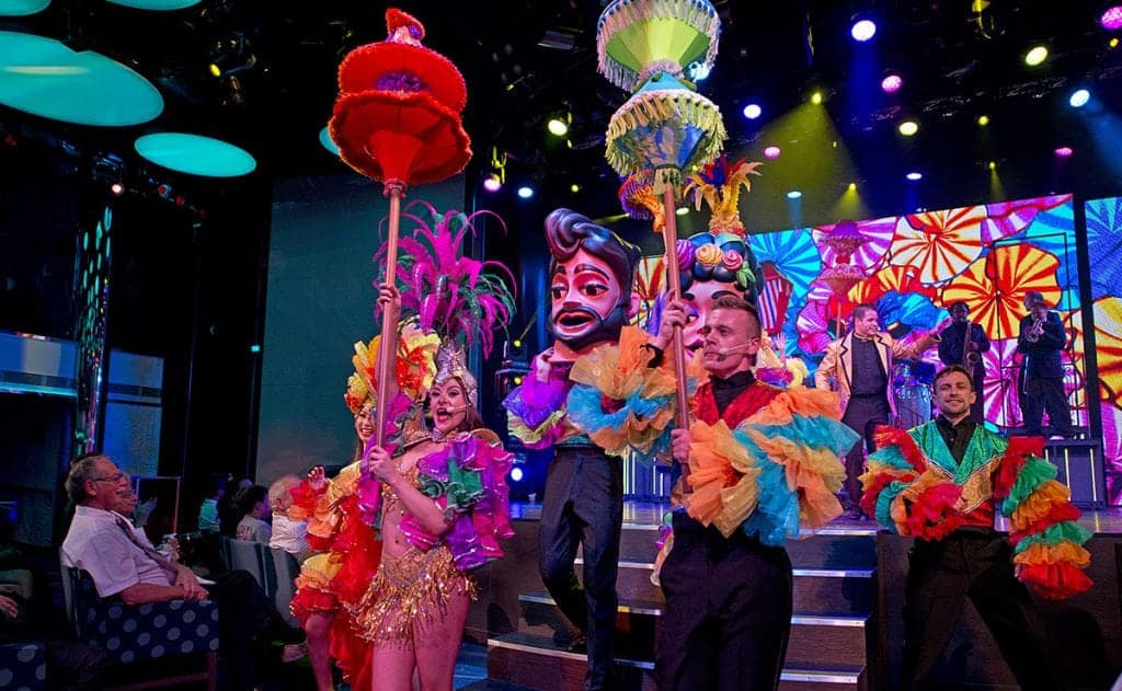 Carnival Vista singers and dancers perform "Amor Cubano" that combines Latin songs with current hits and features a seven-piece Cuban-inspired band in the ship's Liquid Lounge. The largest and most innovative cruise vessel in Carnival Cruise Line's fleet, Carnival Vista measures 133,500 tons, 1,055 feet long and has a guest capacity of almost 4,000 passengers. Photo by Andy Newman/Carnival Cruise Line