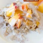 Close up image of crockpot peaches and cream oatmeal recipe in a white bowl with red rim