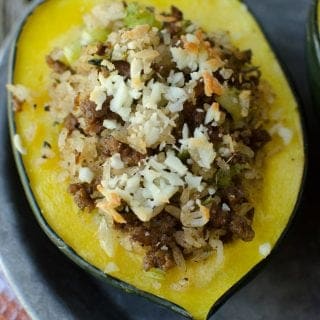 Delicious Sausage and Rice Stuffed Acorn Squash Recipe! So easy to make, great for family dinners, easy to make vegetarian, paleo or vegan!
