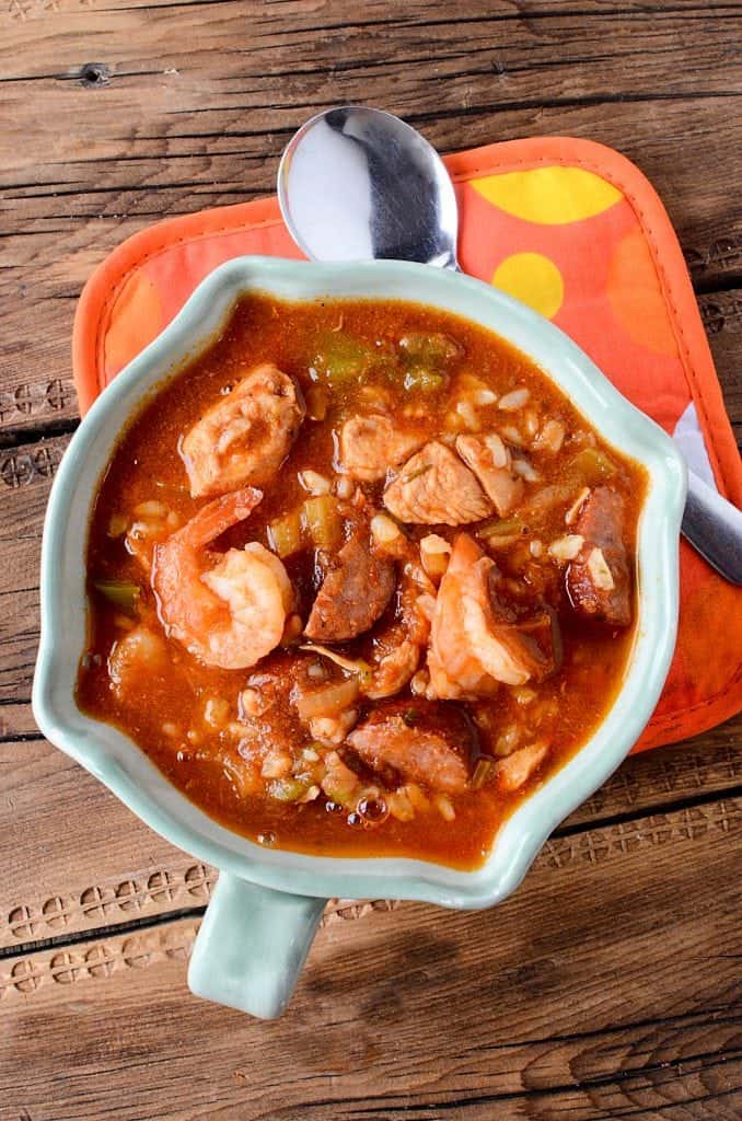 Super easy crock pot gumbo recipe the entire family will love! This cajun slow cooker recipe includes sausage, chicken and shrimp! 