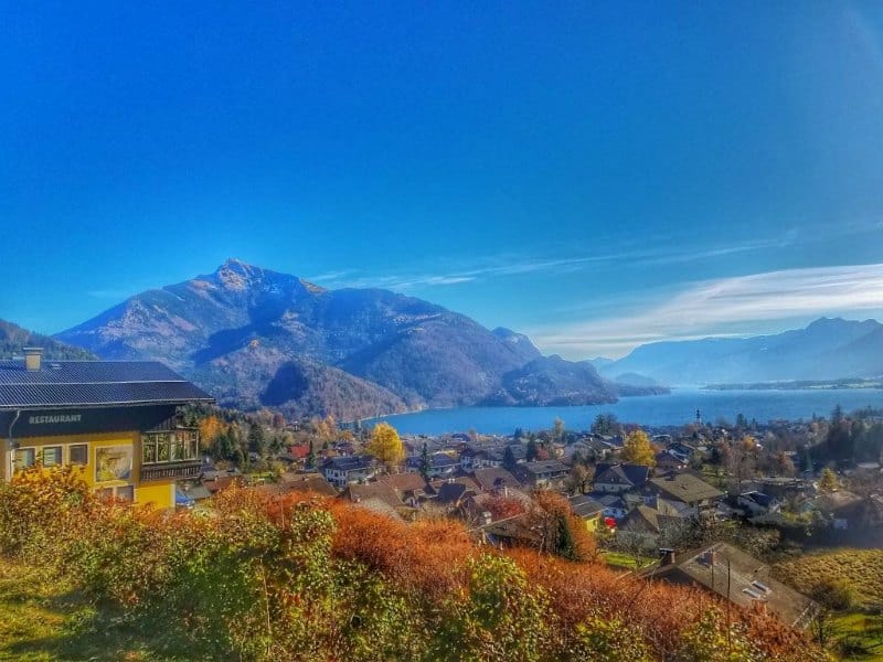 Lake views over a European village and mountains