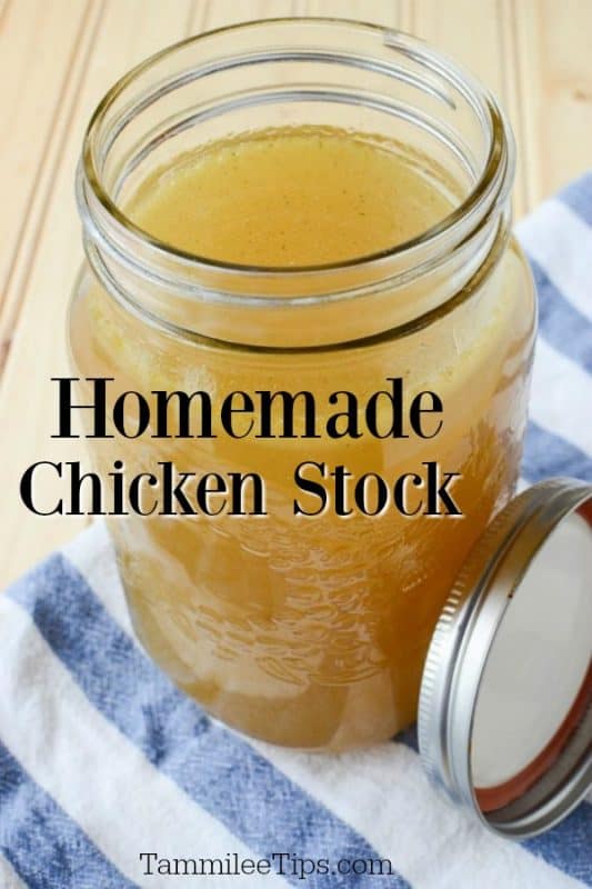 Homemade chicken stock in a mason jar glass on a cloth napkin