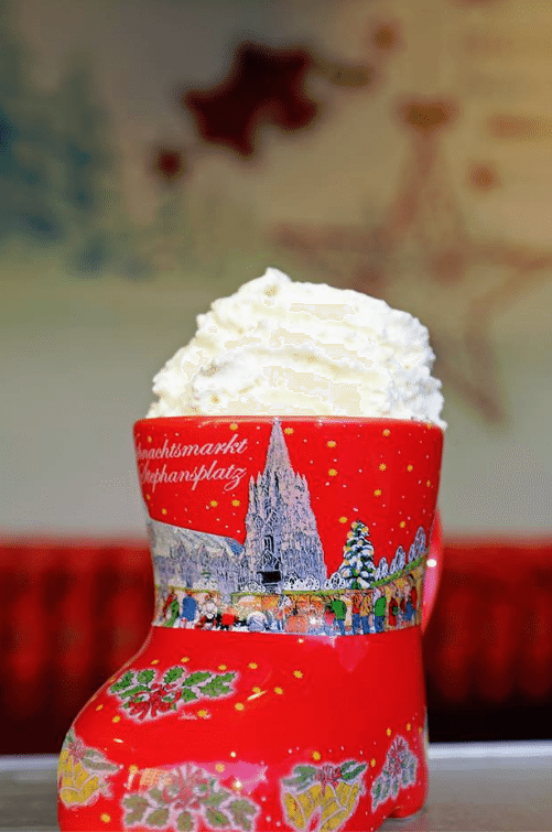 Red Christmas shoe mug with whipped cream. 