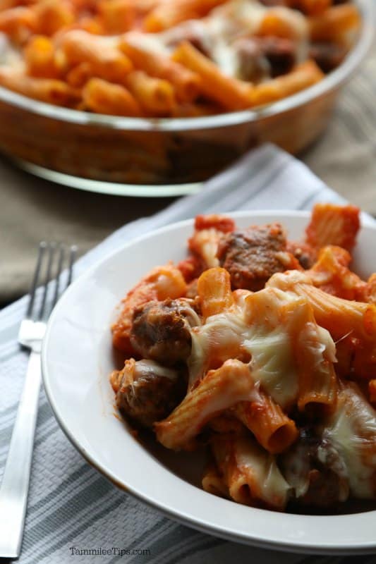 Baked Rigatoni with Mini Meatballs in a white bowl next to a fork