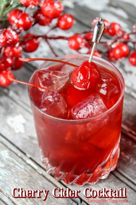 Cherry cider cocktail below a red drink with a maraschino cherry