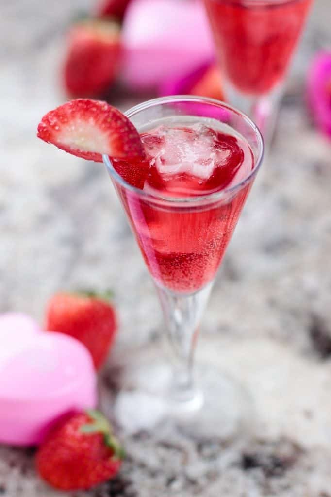 Strawberry Champagne cocktail with a strawberry garnish