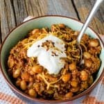 Easy Hot and Spicy Crock Pot Chili Recipe your family will love! Perfect for a cold winters night! So filling and so easy to make! The slow cooker does all the work for you. Filled with bacon, ground beef, and more! One of the best crockpot recipes you can make!