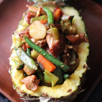 Teriyaki chicken and vegetables in a pineapple bowl