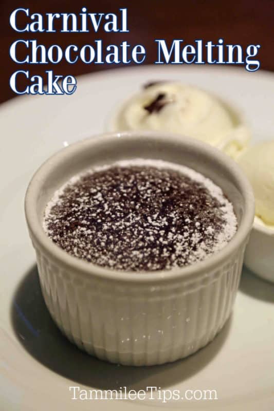 Carnival Chocolate Melting Cake over a white ramekin with chocolate cake in it, next to a bowl of ice cream. 