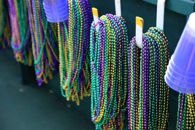 Mardi gras beads and plastic cups hanging inside a float