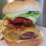 BLT Burger with Avocado Aioli on a white plate